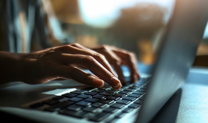 Hands on a laptop keyboard. File pic: iStock