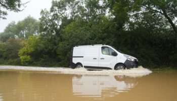 A van in flood water on Hardwater Road near Wellingborough. Pic: PA