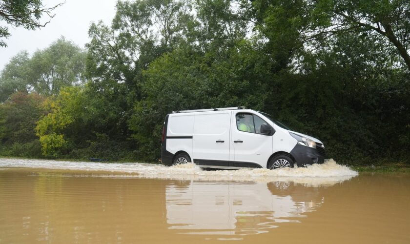 A van in flood water on Hardwater Road near Wellingborough. Pic: PA