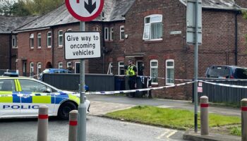 The scene in Salford where a 40-year-old woman and an eight-year-old girl have both been found dead inside a property