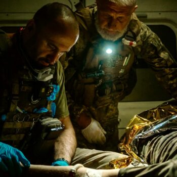 Yaroslav giving first aid in the ambulance. Pic: Alex Rossi