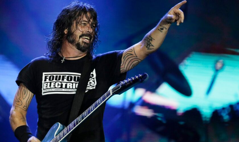 FILE - In this Sept. 29, 2019, file photo, Dave Grohl of the band Foo Fighters performs at the Rock in Rio music festival in Rio de Janeiro, Brazil. Foo Fighters will perform at the iHeartRadio Music Festival in Las Vegas. (AP Photo/Leo Correa, File)