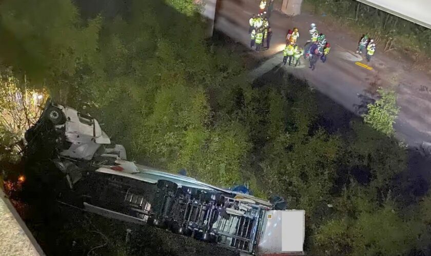 Cheshire Fire and Rescue Service handout photo of emergency services on the scene under a bridge on the M6 in Cheshire where a lorry fell 60 metres from the Thelwall Viaduct between junctions 20 and 21, landing on the embankment below. Issue date: Monday September 30, 2024. Cheshire Fire and Rescue Service/PA Wire