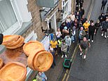 A bloody good time! Hundreds flock to market town to watch annual World Black Pudding Throwing Championships