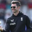 James Anderson tosses a white ball in the air while on coaching duties for England