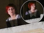 Beloved pop star looks unrecognisable in a cropped red wig as she films her new music video at The Louvre - can YOU guess who it is?