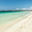 British man, 70, is airlifted to hospital on Spanish holiday island in 'critical condition' after being pulled from the sea by lifeguards performing CPR