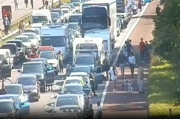 Chaos on M6 as drivers abandon cars to play football during traffic jam