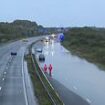 Drivers rescued on M5 after floods leave them stranded in their cars as schools close and roads and railways are left underwater   - latest news