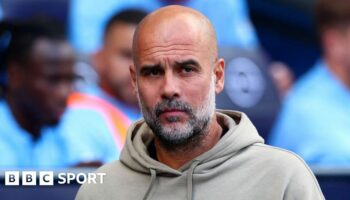 Pep Guardiola looks on