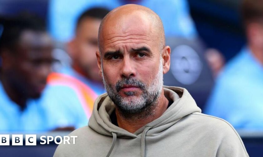 Pep Guardiola looks on