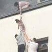 Horrific moment terrified residents lower children from the roof of buildings in Essen after machete-wielding attacker set fire to homes and rammed van into shops injuring 30 'after his wife left him'