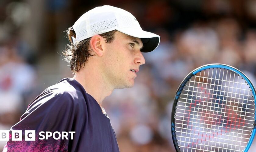 Britain's Jack Draper receives treatment for an abdominal injury before retiring midway through match against Carlos Alcaraz at Indian Wells