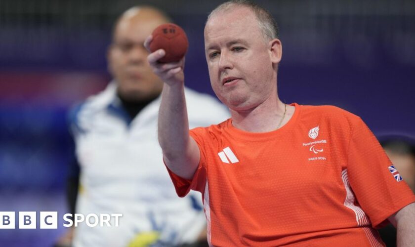 Stephen McGuire prepares to throw the boccia ball in his Paralympic Games final