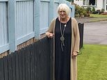 It's fence wars! Feuding neighbours build rival wooden barriers between their gardens after falling out over a lawnmower and hedge trimming