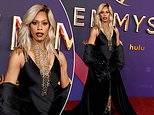 Laverne Cox sparkles in black and gold gown with striking jewelry as she kicks off the red carpet at the 2024 Primetime Emmy Awards