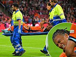 Man City defender Nathan Ake is taken off on a stretcher in tears after suffering serious injury in Netherlands' Nations League clash with Germany