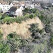 'My house sits on edge of landslide cliff - but I won't move'