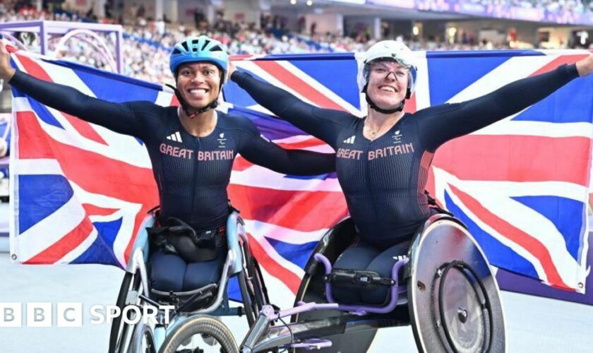 Hannah Cockroft and Kare Adenegan pose with union jack flags