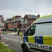 Schoolgirl, eight, and woman, 40, found dead inside Salford home as police say they 'are not looking for anyone else in connection to the deaths'