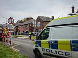 Schoolgirl, eight, and woman, 40, found dead inside Salford home as police say they 'are not looking for anyone else in connection to the deaths'