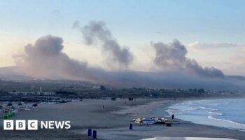 Smoke from several Israeli strikes seen from Lebanon beach