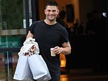 Strictly's Aljaž Škorjanec looks in good spirits as he and wife Janette Manara leave their hotel - amid claims cast and crew are 'furious' he has returned