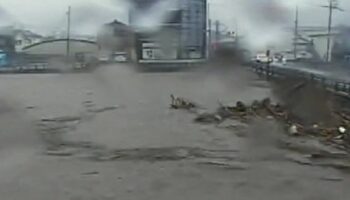 Terrifying moment entire street is submerged as killer floods hit Japan leaving one dead