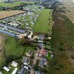 The battle of the barriers: Villagers go to war with wealthy landowner to reopen footpath they sealed off with a fence despite locals using it for nearly 80 years