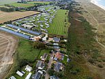 The battle of the barriers: Villagers go to war with wealthy landowner to reopen footpath they sealed off with a fence despite locals using it for nearly 80 years