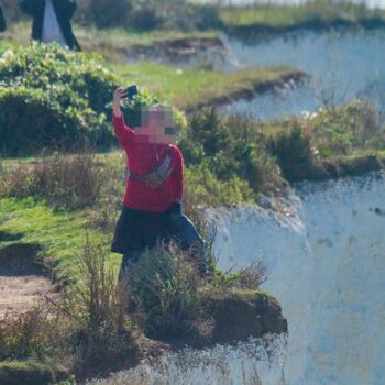 Tourist pictured risking life for selfie by 'very fragile' 530ft cliff edge at UK beauty spot