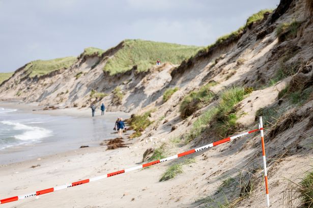 Two boys, 9 and 12, killed in horror beach accident as hole they were digging in sand collapsed