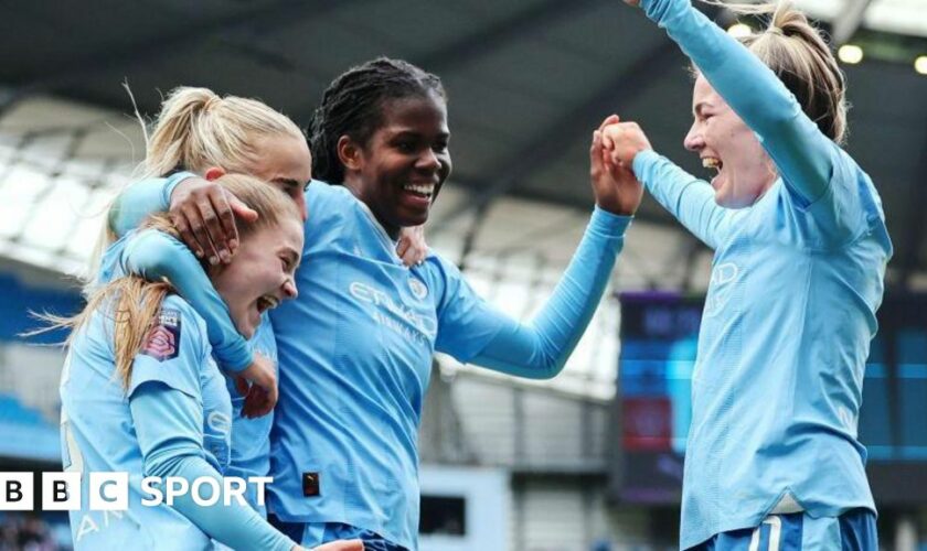 Manchester City celebrate scoring a goal last season