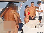 What's happening below deck? Cristiano Ronaldo appears to miss the REAL action as naked couple sail by his superyacht amid holiday with Georgina Rodriguez