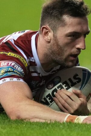 Jake Wardle dives to score a try for Wigan Warriors