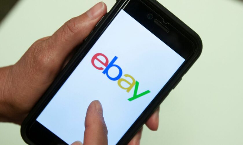 FILE - An eBay app is shown on a mobile phone, July 11, 2019, in Miami. On Wednesday, Sept. 27, 2023, the U.S. Justice Department filed a civil complaint against eBay, claiming the online company unlawfully sold and distributed hundreds of thousands of products that violated various environmental laws. (AP Photo/Wilfredo Lee, File)