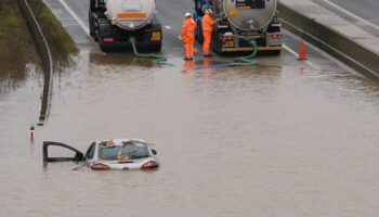 A car is submerged in floodwater on the A421 in Marston Moretaine, Bedfordshire. Pic: PA