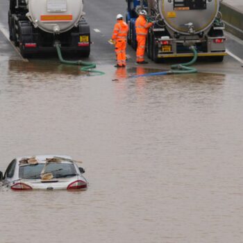 A car is submerged in floodwater on the A421 in Marston Moretaine, Bedfordshire. Pic: PA