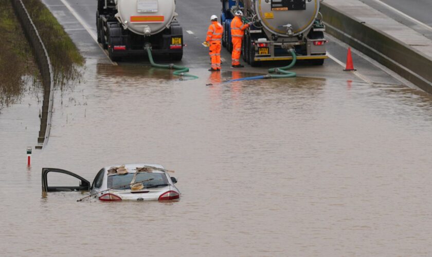 A car is submerged in floodwater on the A421 in Marston Moretaine, Bedfordshire. Pic: PA