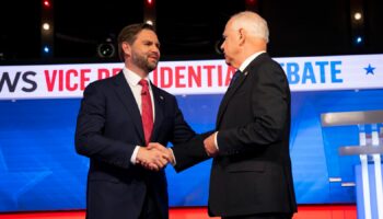 Tim Walz (R) and JD Vance shake hands at the 2024 Vice Presidential Debate Pic: AP