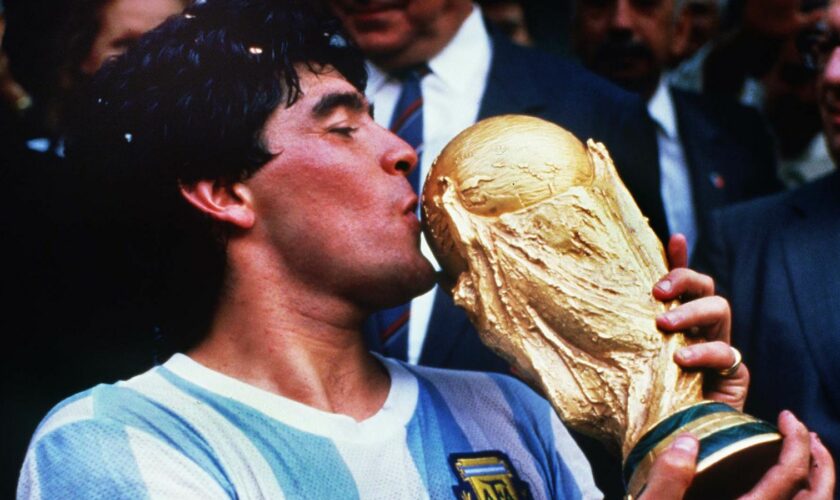 Diego Maradona kisses the World Cup after Argentina beat  West Germany in 1986