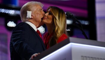 Republican presidential nominee and former U.S. President Donald Trump is joined on stage by his wife Melania after he finished giving his acceptance speech on Day 4 of the Republican National Convention (RNC), at the Fiserv Forum in Milwaukee, Wisconsin, U.S., July 18, 2024. REUTERS/Callaghan O'hare TPX IMAGES OF THE DAY