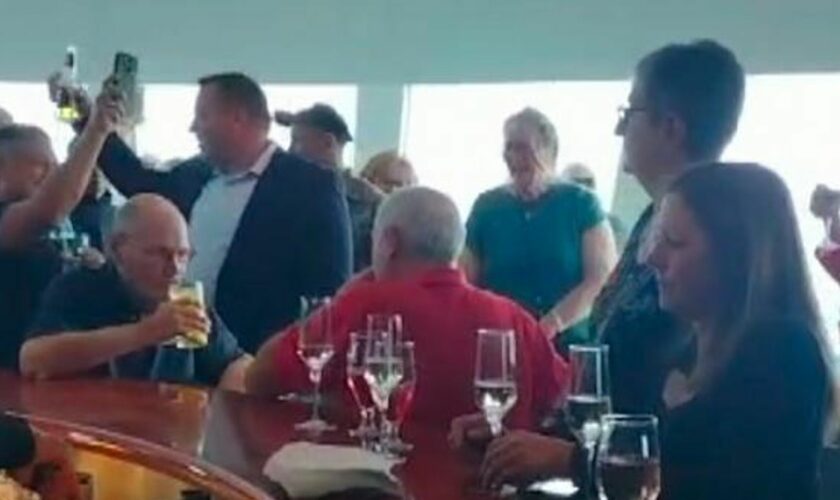 Passengers celebrate as luxury cruise ship stranded for months off Belfast finally sets sail