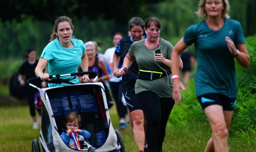 Runners taking part in the Parkrun at Bushy Park in London, the largest and oldest Parkrun in the UK, and one of many runs taking place across the country for the first time since last March. Picture date: Saturday July 24, 2021.