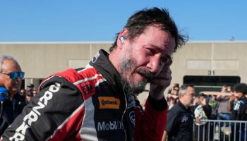 Keanu Reeves drives during the GR Cup Series auto race at Indianapolis Motor Speedway, Saturday, Oct. 5, 2024, in Indianapolis. (AP Photo/Darron Cummings)