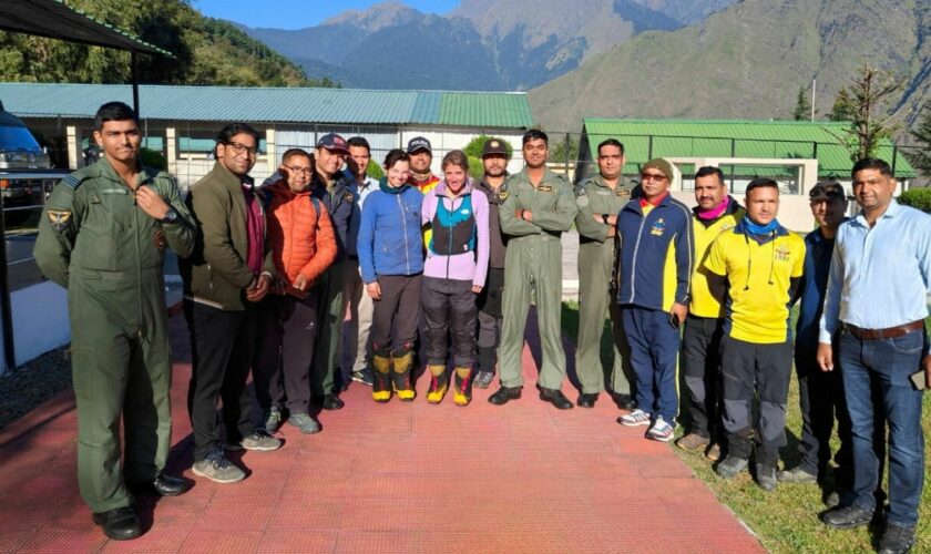 The British and US climbers posing with rescuers in Joshimath, Uttarakhand. Pic: Indian Air Force/Reuters