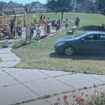 Adults could be seen telling the children to get out the way of the onrushing car. Pic: Minneapolis Police