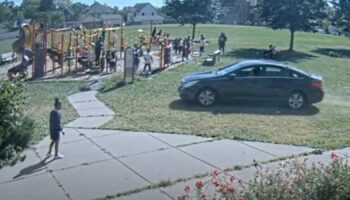 Adults could be seen telling the children to get out the way of the onrushing car. Pic: Minneapolis Police