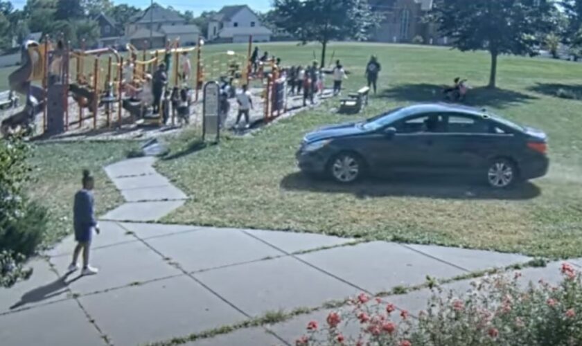 Adults could be seen telling the children to get out the way of the onrushing car. Pic: Minneapolis Police