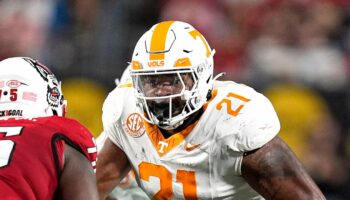 Tennessee player shoves fan storming field to the ground after upset loss to Arkansas